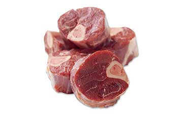 Several raw venison osso bucco, stacked